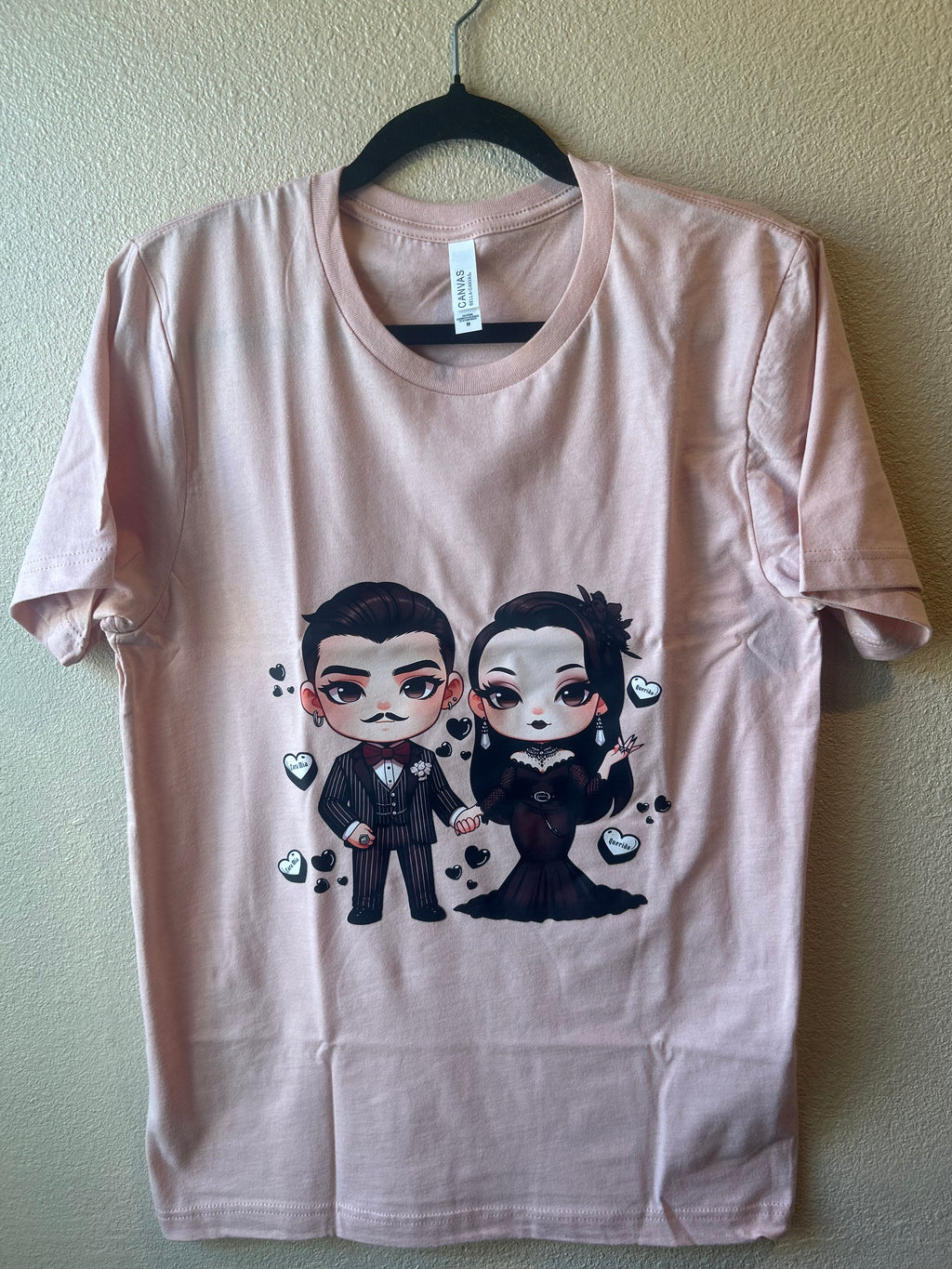 Baby Gomez and Morticia Addams